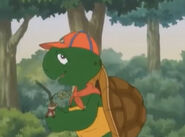 Franklin holding a baby tree in its bag in "Franklin Plants a Tree"