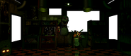 Phantom Chica's face on the FNAF 3 skinned office on one of the arcade cabinets.