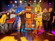 The animatronic performers and their puppeteers.