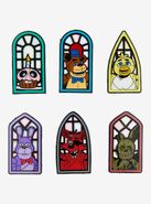 Stained glass portrait pins.