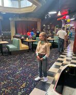 Emma on the pizzeria set.