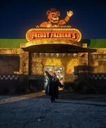 Mckenna Grace outside Freddy Fazbear's Pizza Place.