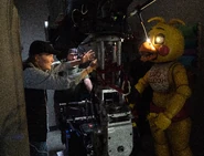 A behind-the-scenes shot of Emma and crew working with Toy Chica.