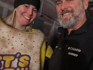 Jess in the Chica suit taking a photo with a crew member.