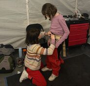 One of the Abby stunt doubles helping Piper.