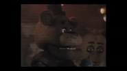 Chica seen behind Freddy performing on stage.