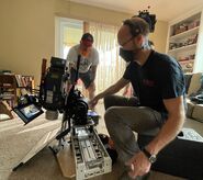 Crew getting a camera ready.