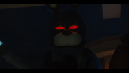 Bonnie with red glowing eyes staring at William Afton getting spring locked.