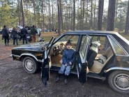 Lucas sitting in William Afton's car.