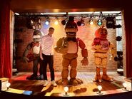 Dawko on stage with Bonnie, Freddy, and Chica.