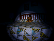 A plushie of Freddy sitting on the Bed.