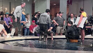 Shooting of a scene involving Mike getting into a fight with someone in a fountain at the mall.