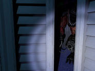 Nightmare Foxy crouching in Closet.