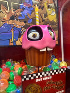 The Cupcake Bonanza machine as seen in PAX West 2023. Note that the screen is missing.