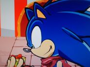 Sonic (Sonic Boom) is holding a smaller present for Sonic