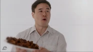 Louis handing out barbeque ribs to Honey and other women in Eddie's fantasy
