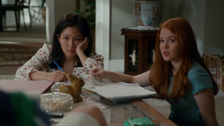Jessica and Tina observe Eddie's antics