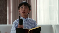 Evan notices Alistair Cain on television