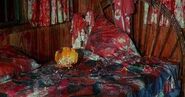 Paula's blood soaked cabin.