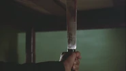Robin impaled beneath the bed