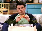 Joey eating pizza