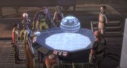 La cellule rebelle Phoenix devant un Hologramme de la station avant l'attaque.