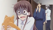 Tohru is shocked by Kyo's transformation into a cat.