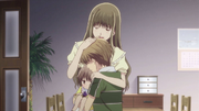 Satsuki's family sharing a group hug.