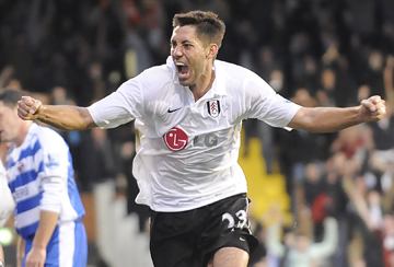 Fulham's Clint Dempsey (left) celebrates after scoring the opening