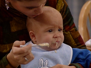One of the babies eating his first solid food