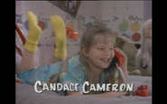 D.J. (Candace Cameron) talking on the phone in her bedroom