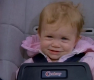 Michelle (Mary-Kate & Ashley Olsen) sitting in her car seat