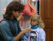 Stephanie pouts in an attempt to get Jesse to play with her