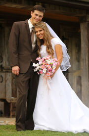 Brandon and Michael in wedding clothes, Brandon is taller than Michael