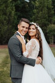 Carlin and Evan hugging on their wedding day