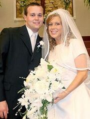 Josh and Anna on their wedding day, looking young and awkward