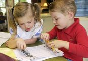 Joy and a brother doing school