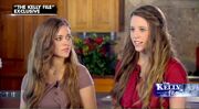 Jessa and Jill sitting in front of the kitchen counter