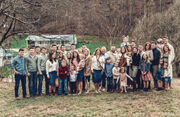 Picture of the Bates family in winter, so the trees are bare