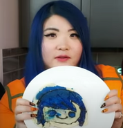 Kat holding pancake