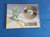 A golden record presented to  for the sale of 10,000 copies of the album in Poland.