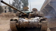 Syrian Tank in a totaled neighborhood