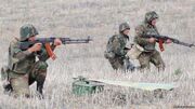 Soldiers from Artsakh in firing positions.