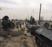 Captured armored vehicles and tanks in a Hezbollah parade