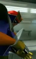The very brief shot of Captain Falcon reloading his gun in his garage.