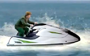 Liam in a jet ski, without his hat.