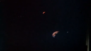 Three planetary bodies in the Hatari Sector, as viewed from Cpt. Adama's Viper console.
