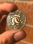 Tails side of die-cast mufen coin