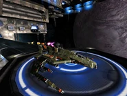 Skuld firing on Dark Angel that is docked.