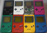 Eight Play it Loud! Game Boys in Black, Green, Red, Yellow, Transparnet, White, Blue, and Pink.